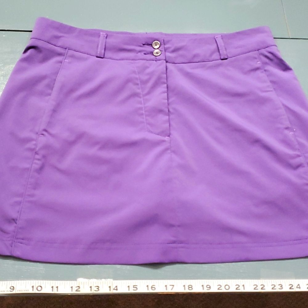 CROSS,‎ women's skort. Purple with pockets size 12 usa size 42 European size.